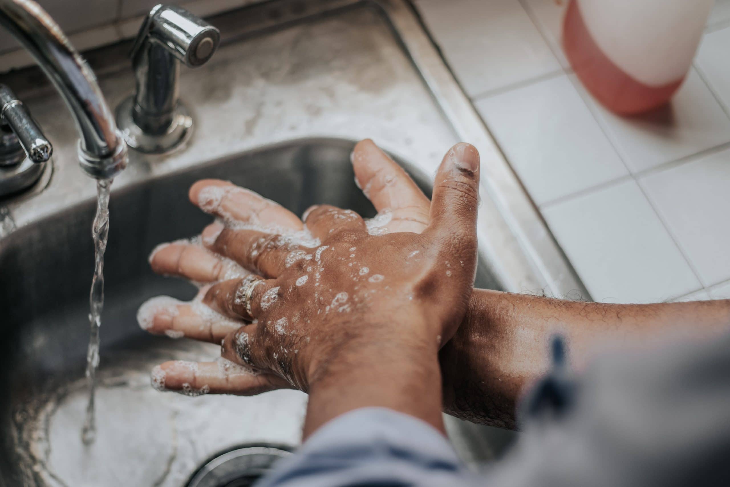 Man washing hands at a sink