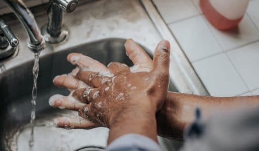 Man washing hands at a sink