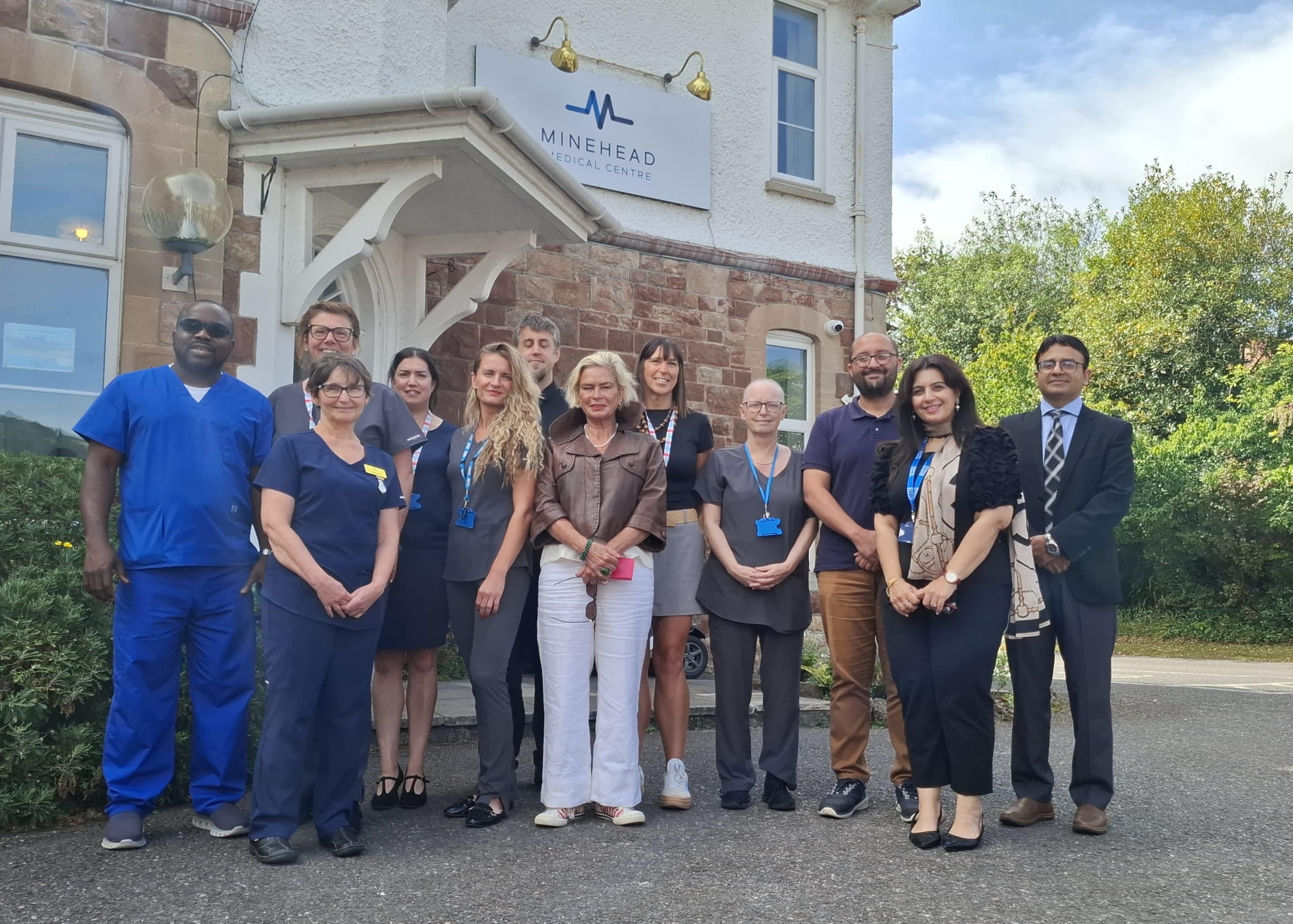 Minehead Medical Centre Team, ICB Team and Rachel Gilmour MP gather outside Minehead Medical Centre.